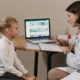 Cognitive intervention in children with ADHD. A professional working with a girl with ADHD through NeuronUP.