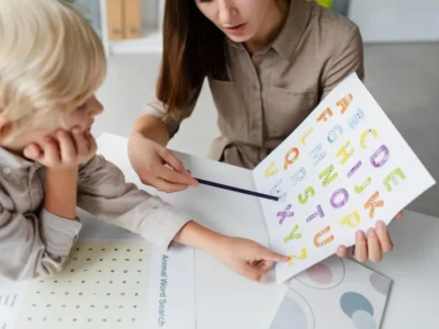 Child undergoing speech-language therapy with a speech-language pathologist for a language disorder or TEL.