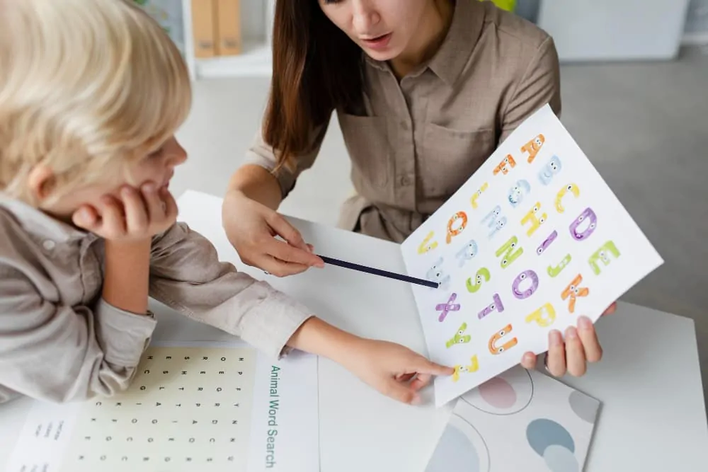 Child undergoing speech-language therapy with a speech-language pathologist for a language disorder or TEL.