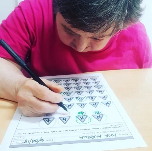 User using new technologies for people with intellectual disabilities