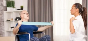 Nurse working with a patient with a neurodegenerative disease