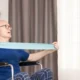 Nurse working with a patient with a neurodegenerative disease