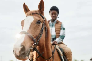 Hippotherapy. Girl riding a horse.