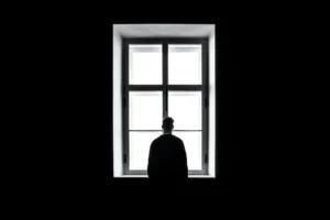 Celebrities contribute to mental health. A man looking out the window.