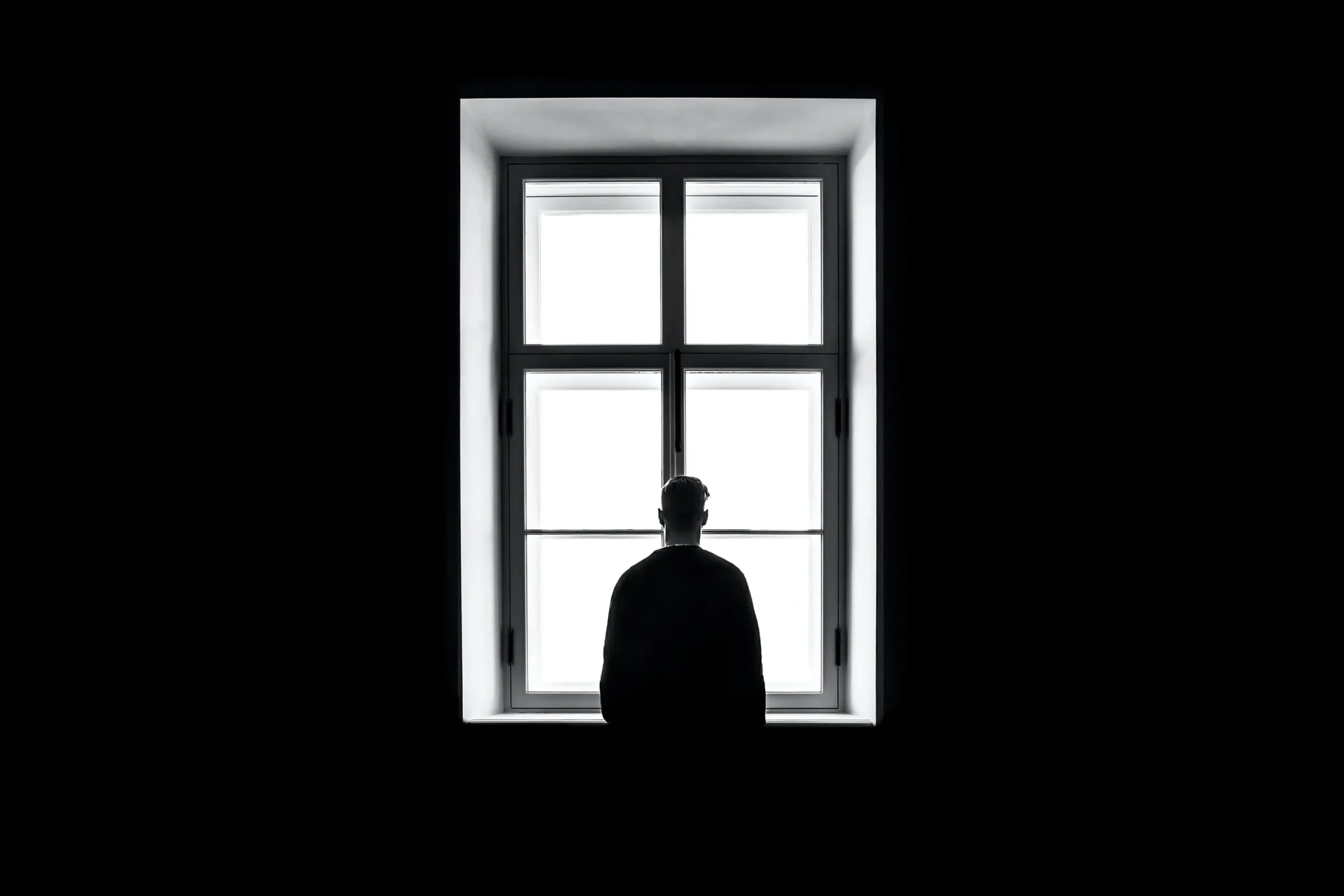 Celebrities contribute to mental health. A man looking out the window.