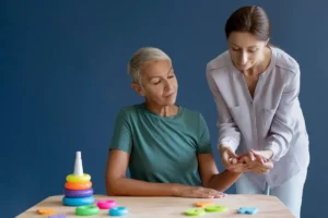 Occupational therapist, performing a daily living activity for a patient