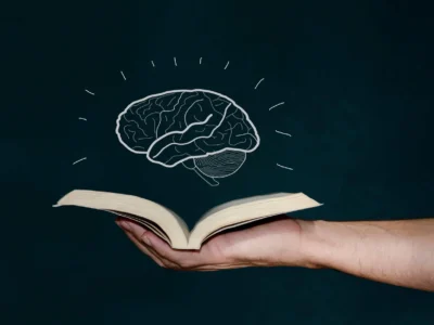 Benefits of reading. Hand holding a book.