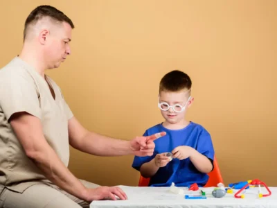 Neurodevelopmental disorders. Child with autism playing with a professional.