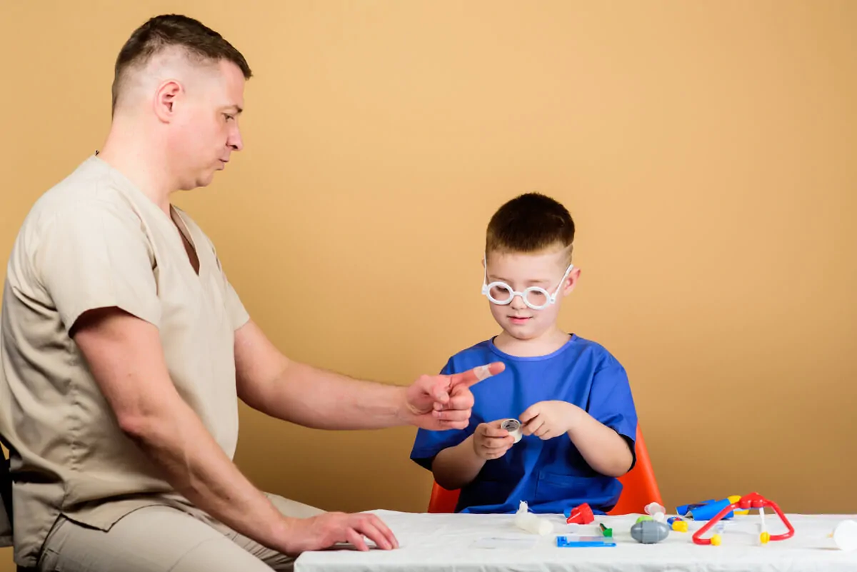 Neurodevelopmental disorders. Child with autism playing with a professional.