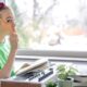 Towards a neurodidactics of musical learning. Girl thinking, doing music exercises with a piano.