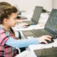 Girl with a laptop playing with NeuronUP activities