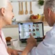 Two older adults using a laptop with NeuronUP2GO