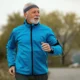 Illustration of an older man running outdoors beside a brain, depicting physical activity and preclinical Alzheimer’s disease.