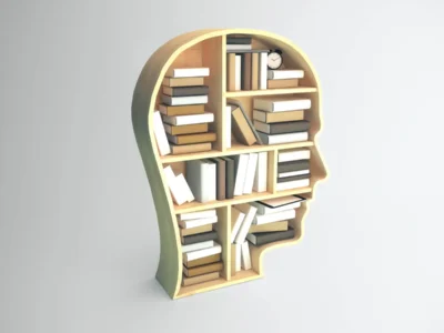 Profile-shaped bookshelf filled with books and a clock, featuring a modern design on a light background.
